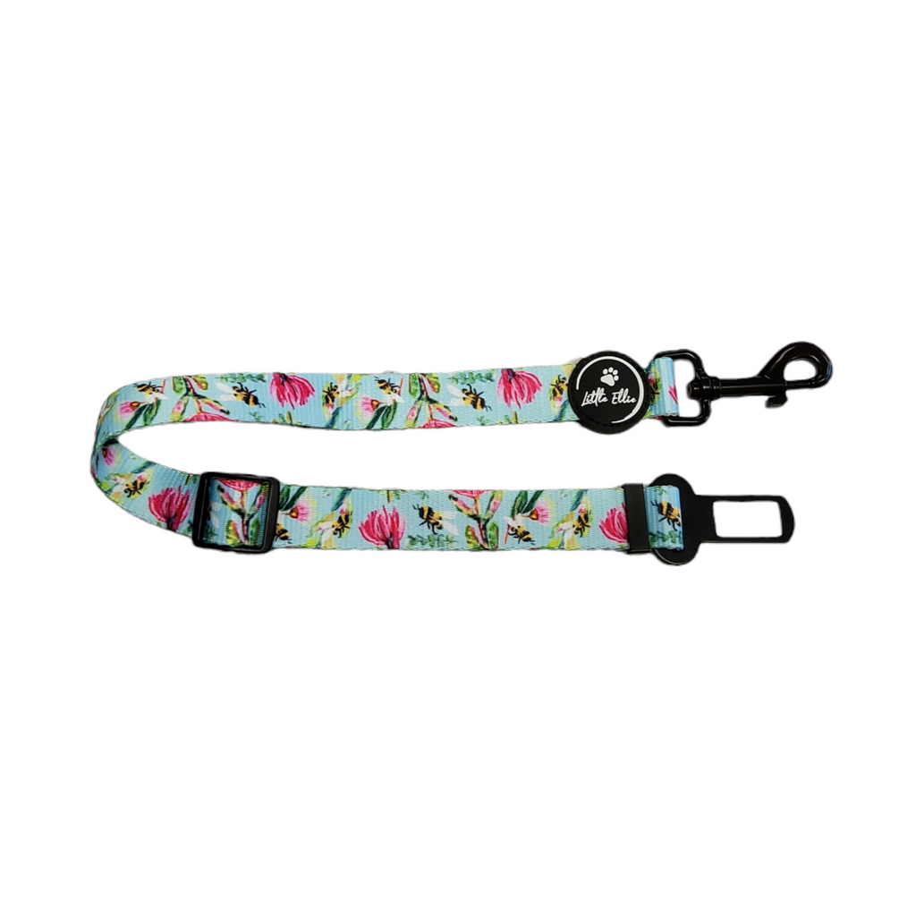 Adjustable dog car restraint in colourful native bees design